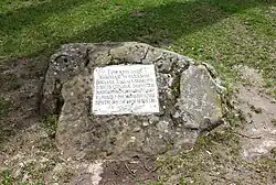 An inscription on a stone near the wells
