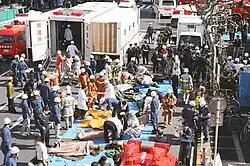 Large-scale rescue operations with a expandable special ambulance deployed.