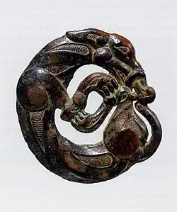 Harness ornament in the shape of a coiled wolf, characteristic of nomadic artifacts of southern Ningxia and southeastern Gansu, 5th-4th century BC.[102][99]