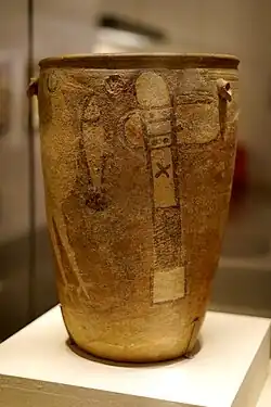 Painted pottery of Neolithic Yangshao culture, with depiction of a stork catching a fish and a stone axe on the side