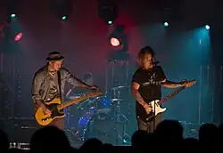 The Almost performing in Sydney, Australia in 2011. From left to right, Dusty Redmon, Joe Musten (back), and Aaron Gillespie.