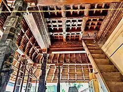 Traditional rafters, wooden ceiling and wooden stairs.