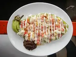 Philippine ensaladang talong, a salad on grilled and skinned green eggplant