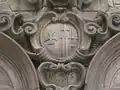 The arms of the hospital, on the chapel wall, carved by Pere Costa