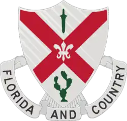 The shield is white, the old Infantry color. The saltire is taken from the Florida State flag. The sheathed sword, from the Spanish War service medal, represents service during that war. The cactus symbolizes service on the Mexican Border, and the fleur-de-lis, service during World War I.[1]