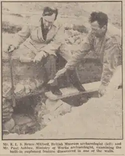 Black & white photograph of Rupert Bruce-Mitford and Paul Ashbee excavating at the Mawgan Porth Dark Age Village