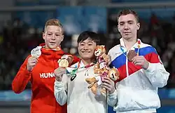 Floor exercise victory ceremony (from left to right): Krisztián Balázs (Silver), Takeru Kitazono (Gold), Sergei Naidin (Bronze)