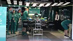 AMR25 being assembled in the pit building prior to the 2025 Japanese Grand Prix