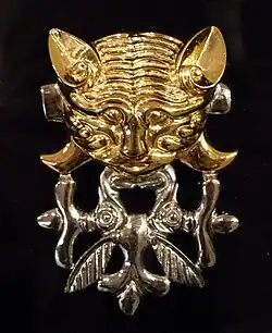 Catlike predator with protomas of two elk, burial mound Berel (IV.-III. BCE) Kazakhstan, Pazyryk culture.[11]