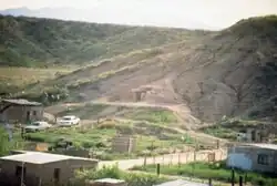 Buildings and a hill