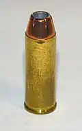 .45 Colt cartridge featuring a jacketed hollow point bullet