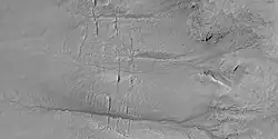 Close view of gully channels, as seen by HiRISE under HiWish program Channels make some tight curves.