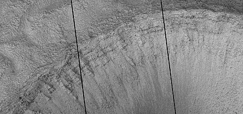 Close view of layers in crater, as seen by HiRISE under HiWish program. Dark line are defects in image. This image was taken during a global dust storm.