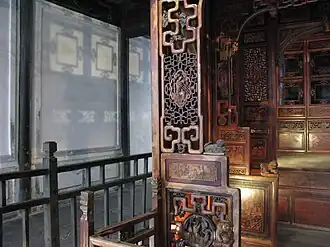 This image demonstrates the openwork carving of a bed frame in Wuzhen