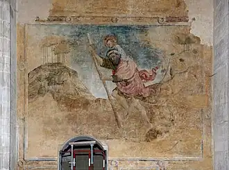 "Good-natured giant Saint Christopher carrying the child Jesus." Abbey church of Saint-Antoine l'Abbaye, France