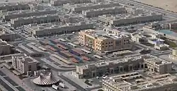 Aerial view of Umm Besher in 2014 with CentrePoint Mall in focus