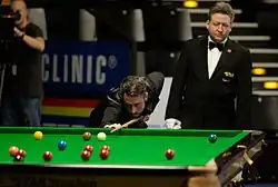 Alfie Burden playing a shot