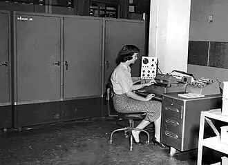 Programmer Irma Lewis at the console of the Alwac III computer, 1959.