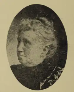 Portrait photo of an old woman with white hair.