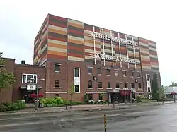 Three-storey red brick building
