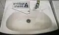 Armitage Shanks logo on a sink