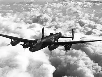 An inflight image of a four-engined bomber aircraft