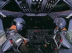 The interior of a B-1B cockpit at night