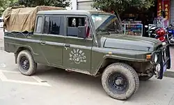Liangshan Yi autonomous prefecture government Beijing BJ2032 SAQ pickup which combines the 1965 nose with the post-2000 doors.