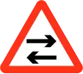 Two way traffic crosses one way road