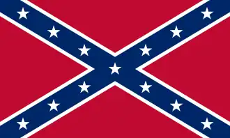 The Confederate battle flag: a blue saltire with white stars, bordered in white, on a red field.