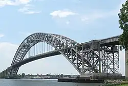 The Bayonne Bridge, a mid-bearing through arch bridge spanning the Kill Van Kull, connecting Bayonne, New Jersey, with Staten Island, New York City