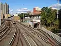 Concourse Yard revealing a tunnel where D and B trains enter the yard. Tracey Towers is in the background.