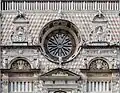 Rose window and busts of Caesar and Trajan