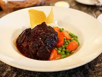 With buttered carrots and peas