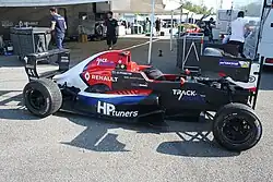 Piastri's Tatuus FR2.0/13 in the paddock of the 2018 Eurocup Formula Renault Monza round with its nose folded upwards