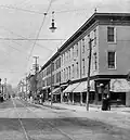 Bloom Brothers Chambersburg #1, 84 South Main Street (first store from right), 1897-1900 and 1900-1903, respectively (Postcard image)[28]