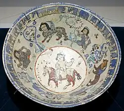 Rider in centre, with sphinxes in a band