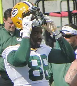 Bostik in uniform about to put his helmet on.