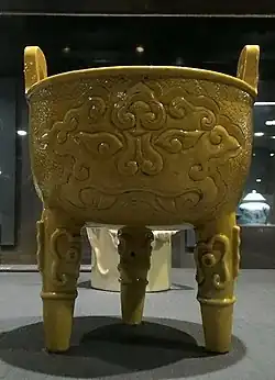 Mascaron on a bright yellow cauldron, before the 17th century, ceramic, National Palace Museum, Taipei, Taiwan