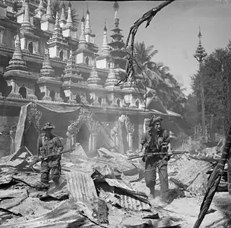 Image 29British soldiers on patrol in the ruins of the Burmese town of Bahe during the advance on Mandalay, January 1945 (from History of Myanmar)