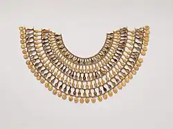 Wide necklace of 6 rows of gold beads