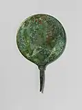 A bronze mirror, of the type associated with Venus