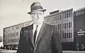 Lester E. Cox standing in front of Burge Hospital in 1966