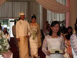 Image 13A wedding procession, with the groom and bride dressed in traditional Burmese wedding clothes, reminiscent of royal attire (from Culture of Myanmar)