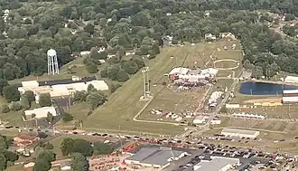 Close-up aerial view showing the Butler Farm Show Grounds (right) on the day of the rally with the building (left) that the shooter climbed on