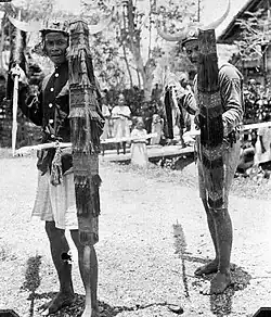 Two cakalele dancers holding kanta shields from Donggala Regency, Central Sulawesi