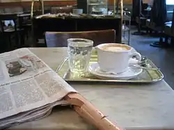 Image 36Coffee house culture between Vienna and Trieste: the coffee, the newspaper, the glass of water and the marble tabletop (from History of coffee)