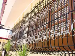 Las Piñas Gabaldon Hall's row of capiz-shell windows with grills