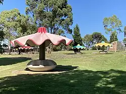 Umbrellas and former monkey dome/bird cage