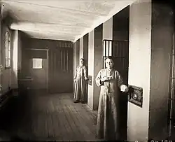 Female inmates in front of their cells, 1895